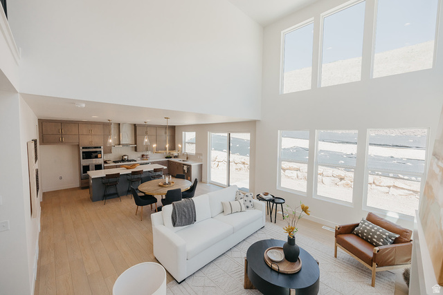 5902 Canyon Rim Road, Unit 620 Lehi, UT 84048 - Photo 17 of 78 Expansive open-concept living space featuring high ceilings and wood-finish flooring