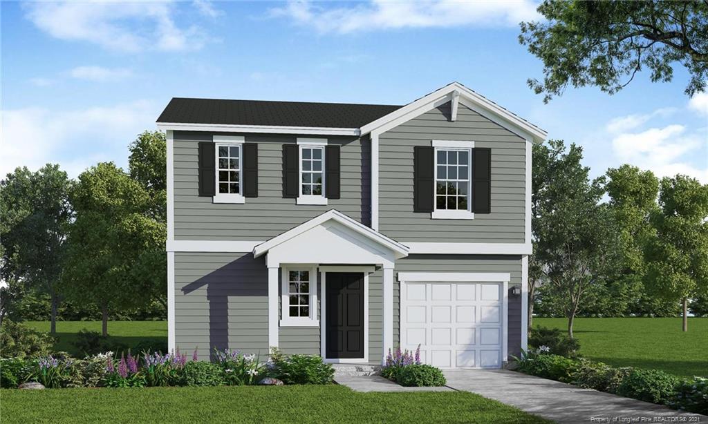 5919 Lowgrass Road Stedman, NC 28391 - Photo 1 of 1 a front view of a house with garden