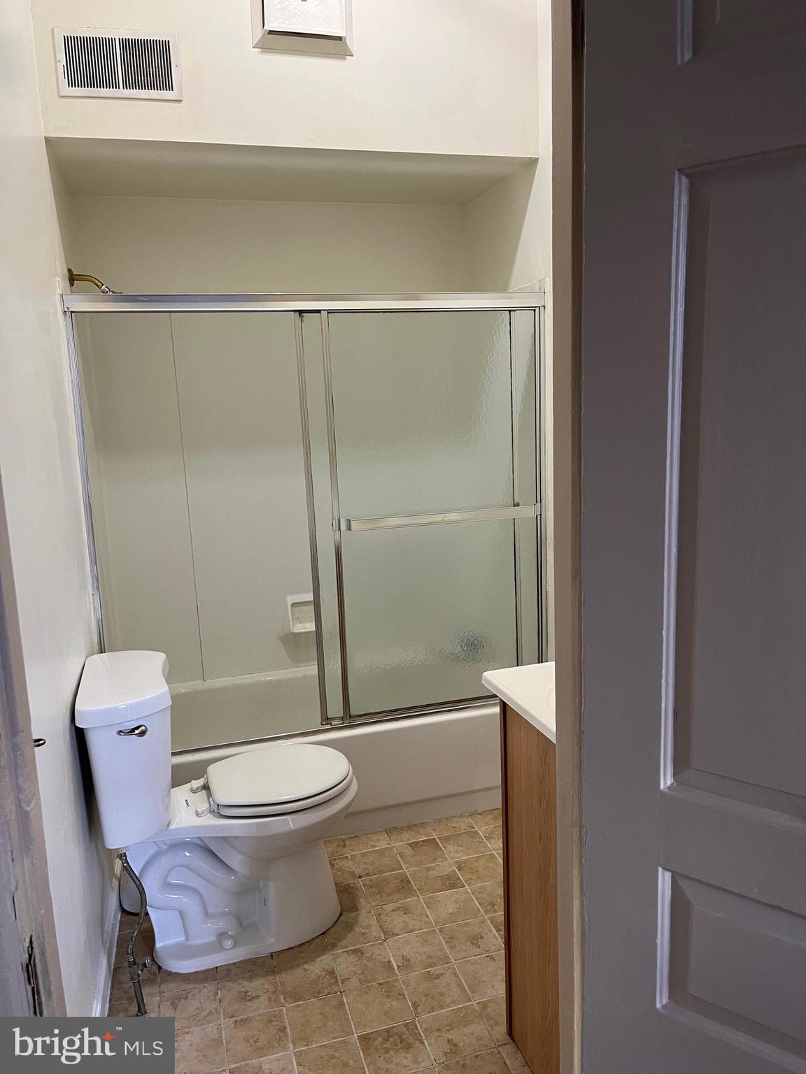 421 East High Street, Unit 3 Pottstown, PA 19464 - Photo 16 of 20 a bathroom with a toilet and a shower
