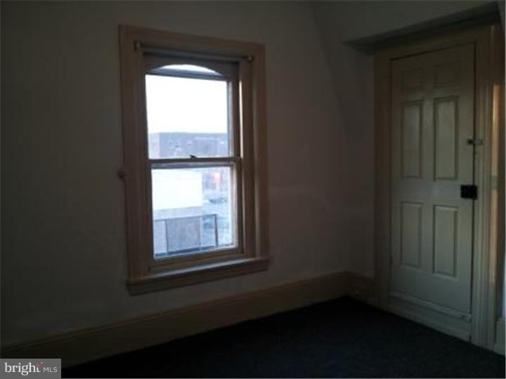 421 East High Street, Unit 3 Pottstown, PA 19464 - Photo 19 of 20 a view of an empty room with a window