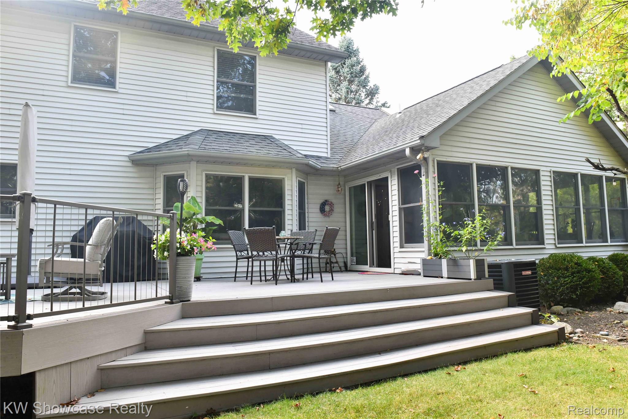 3559 Timber Ridge Drive Metamora, MI 48455 - Photo 5 of 35 Rear view of property featuring outdoor dining area, a shingled roof, and a wooden deck