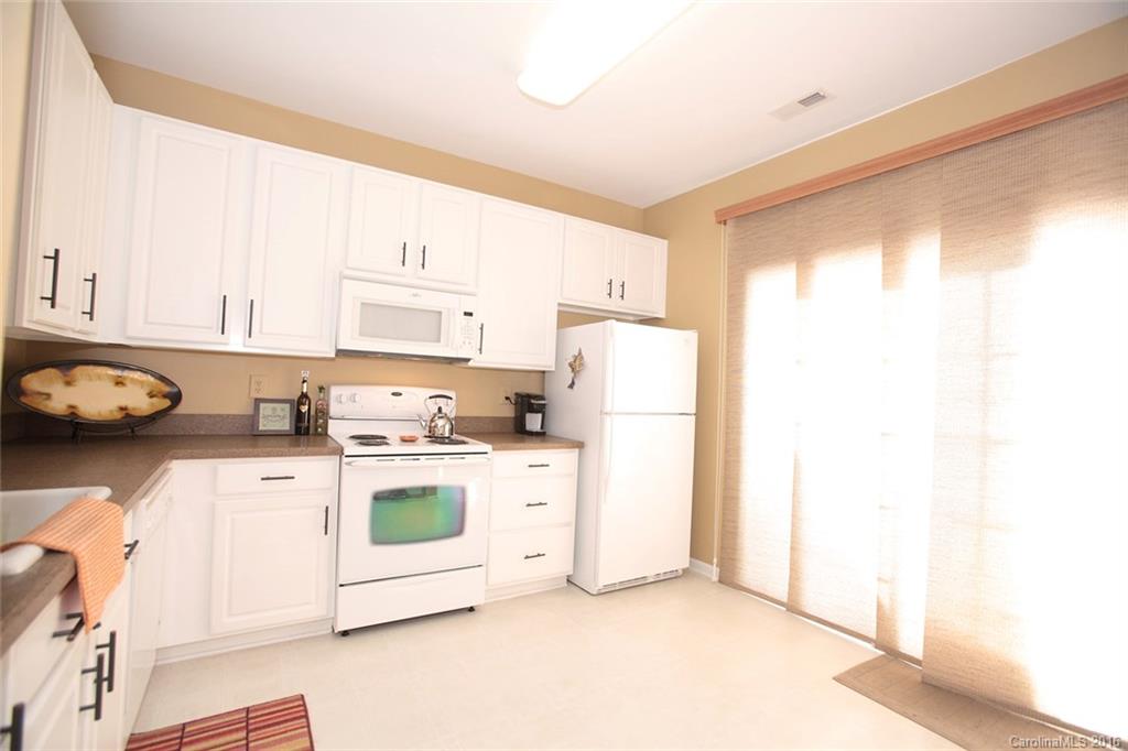 831 Gentlewinds Court, Unit 122 Fort Mill, SC 29708 - Photo 12 of 19 a kitchen with a white cabinets and white appliances