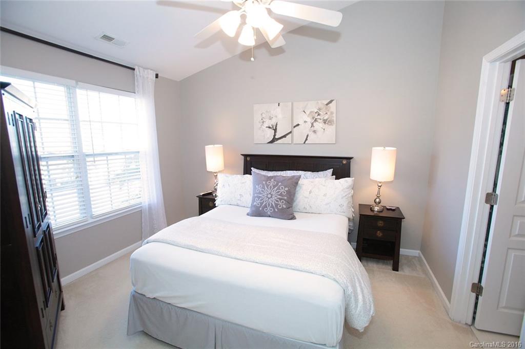 831 Gentlewinds Court, Unit 122 Fort Mill, SC 29708 - Photo 14 of 19 a bedroom with a bed and a window