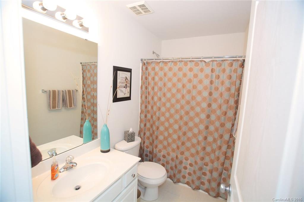 831 Gentlewinds Court, Unit 122 Fort Mill, SC 29708 - Photo 15 of 19 a bathroom with a sink toilet and shower