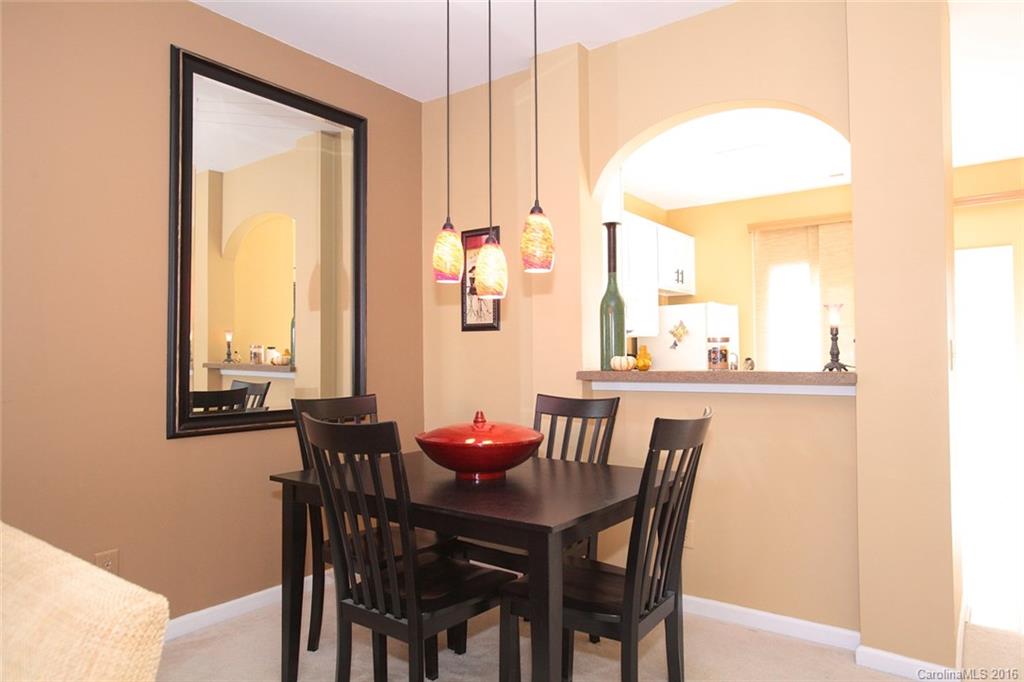 831 Gentlewinds Court, Unit 122 Fort Mill, SC 29708 - Photo 7 of 19 a view of a dining room with furniture and window
