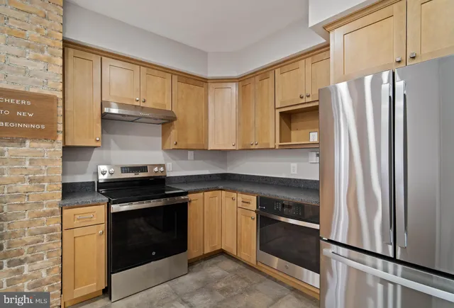 a view of room with hardwood floor and window