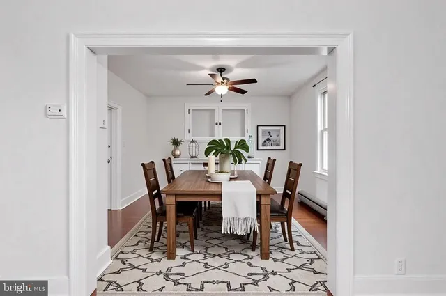 a living room with furniture a rug and a chandelier