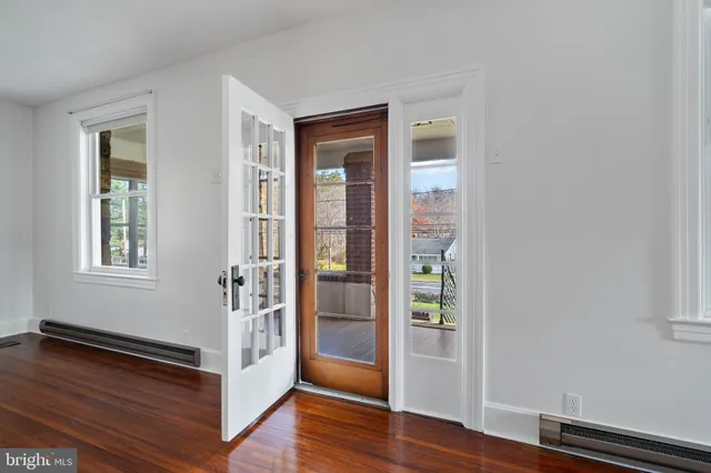 a view of staircase with railing and white walls