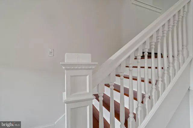 an empty room with a empty space and windows