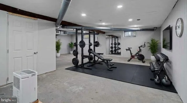 a front view of a house with a yard table and chairs