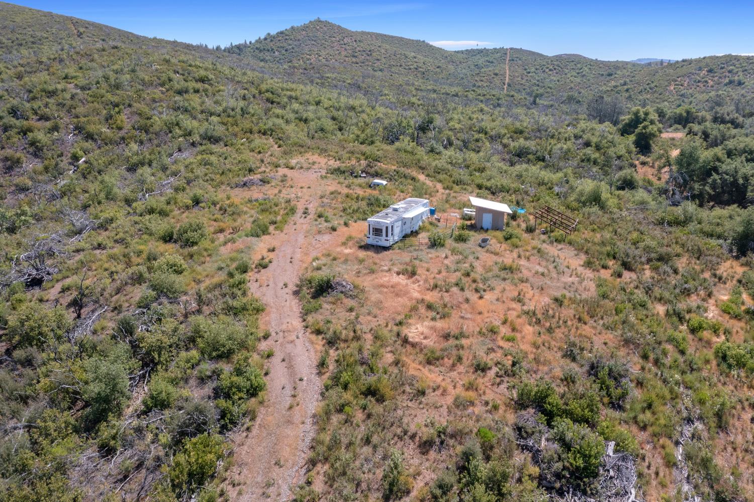 6165 Blue Eagle Mine Road Mountain Ranch, CA 95246 - Photo 5 of 13 a view of a mountain in the distance in a field