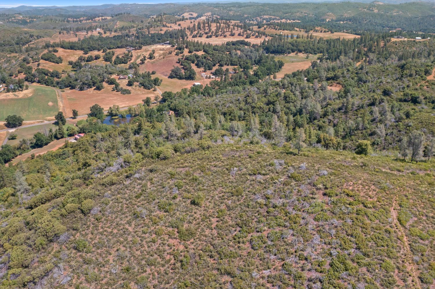 6165 Blue Eagle Mine Road Mountain Ranch, CA 95246 - Photo 9 of 13 an aerial view of residential house with parking space and mountain view in back
