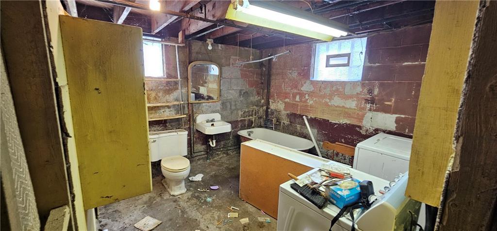 404 Ridgelawn Avenue New Castle, PA 16105 - Photo 18 of 34 a bathroom with a sink toilet and shower