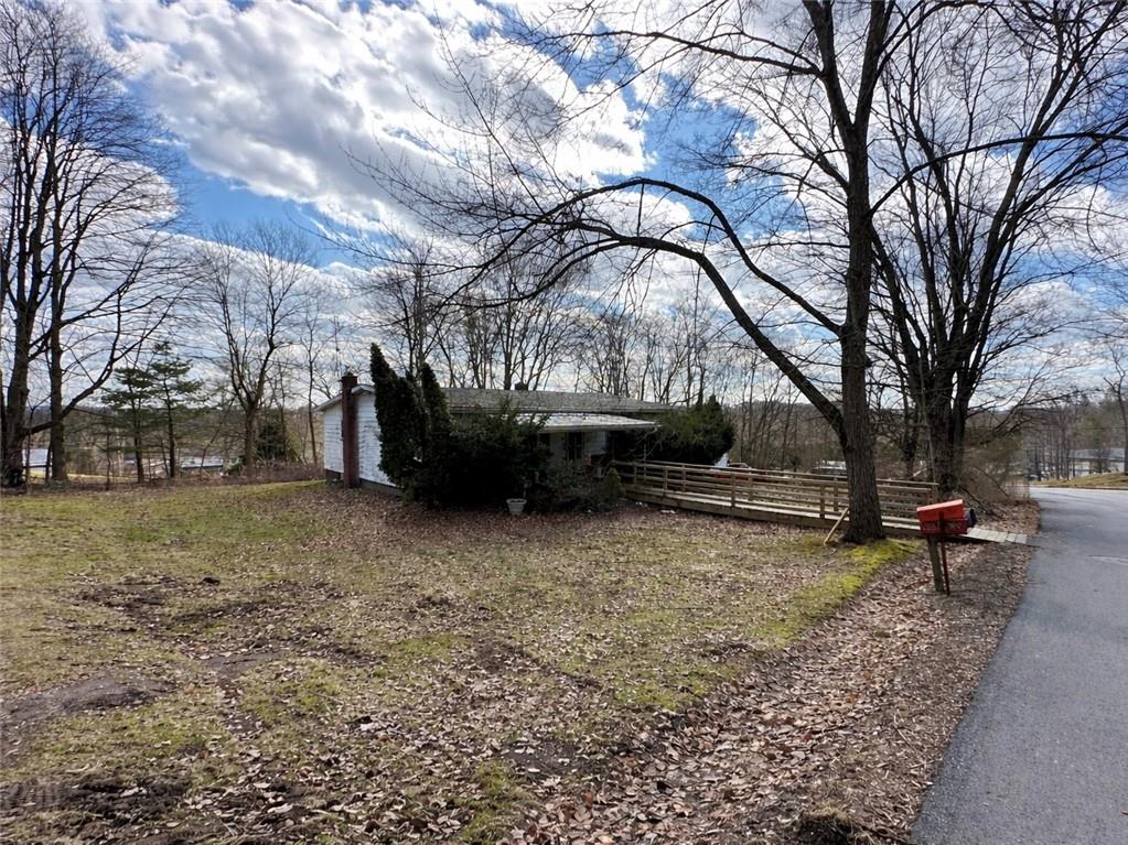 404 Ridgelawn Avenue New Castle, PA 16105 - Photo 2 of 34 a view of a yard with a tree