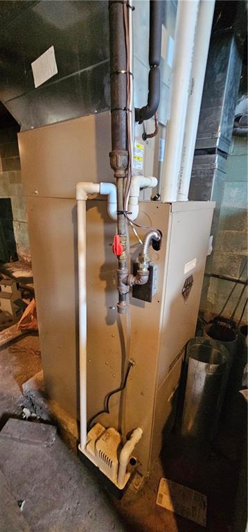 404 Ridgelawn Avenue New Castle, PA 16105 - Photo 21 of 34 a room with water heater and wooden cabinets