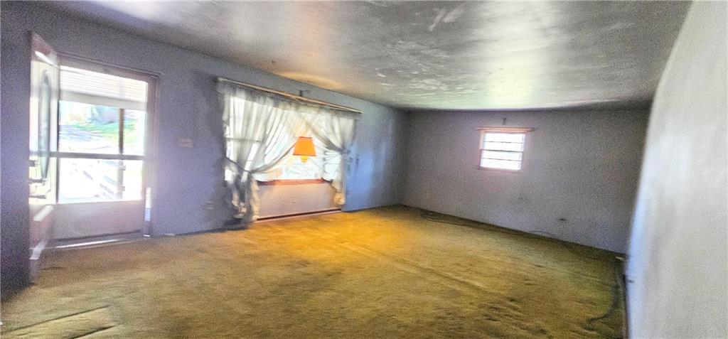 404 Ridgelawn Avenue New Castle, PA 16105 - Photo 5 of 34 a view of an empty room with a window