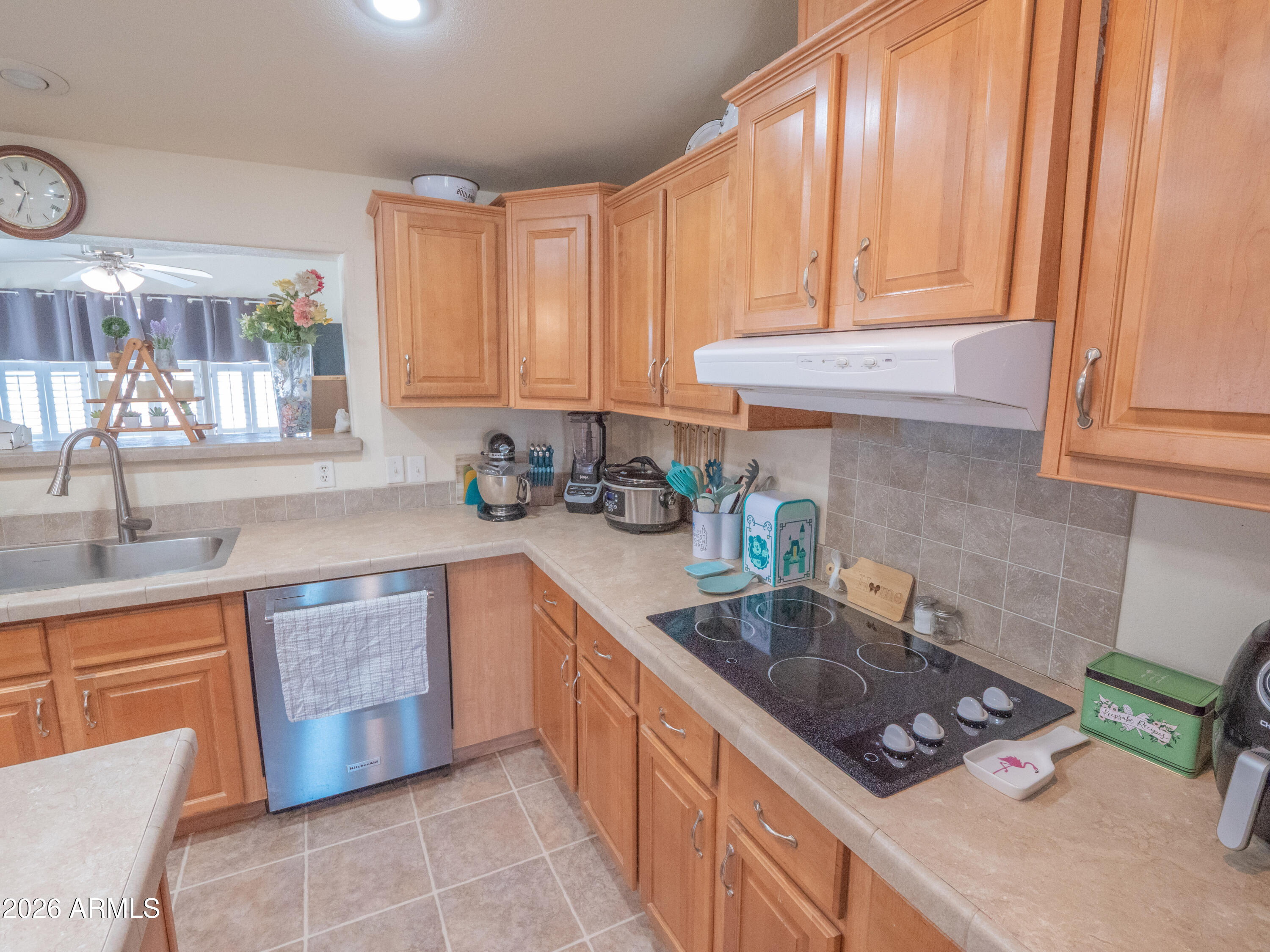1401 Ranch Road Taylor, AZ 85939 - Photo 17 of 61 a kitchen with stainless steel appliances granite countertop a sink stove and cabinets