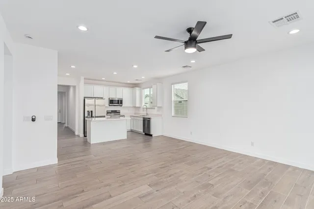 a view of kitchen with wooden floor and window
