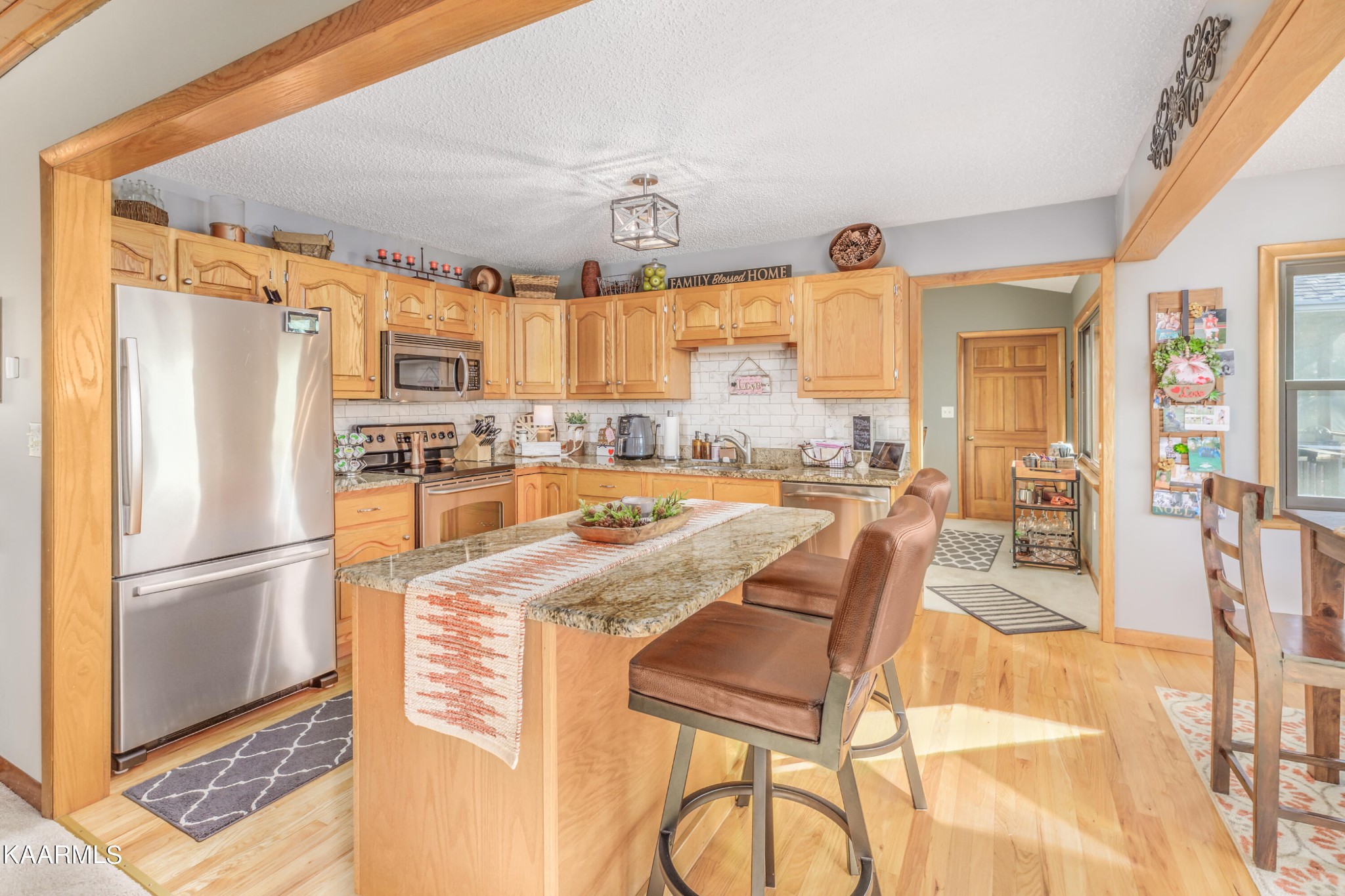 1145 Country Club Road Dandridge, TN 37725 - Photo 15 of 37 a kitchen with stainless steel appliances granite countertop a refrigerator and a stove