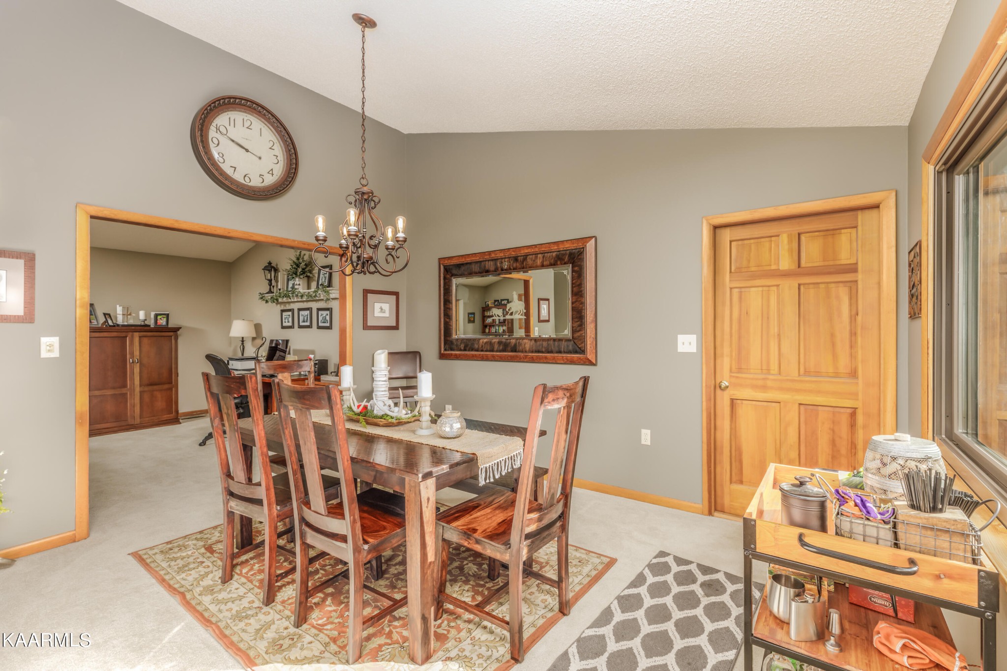 1145 Country Club Road Dandridge, TN 37725 - Photo 17 of 37 a view of a dining room with furniture and a chandelier