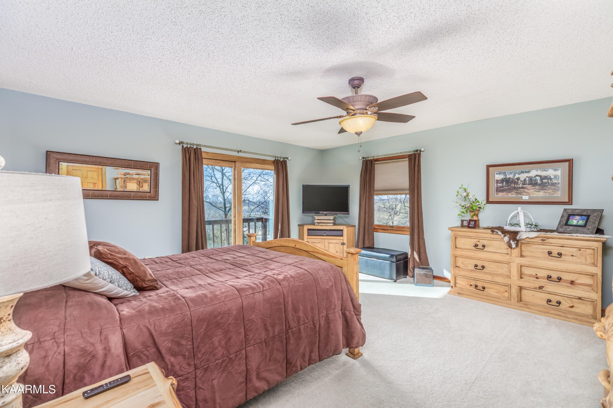 1145 Country Club Road Dandridge, TN 37725 - Photo 19 of 37 a spacious bedroom with a bed a dresser next to a window