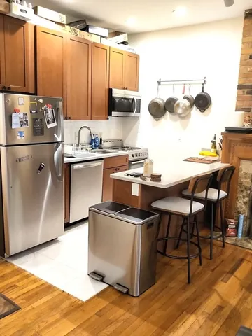 a kitchen with a sink cabinets and appliances