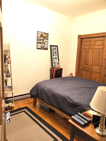 a bedroom with a bed and furniture