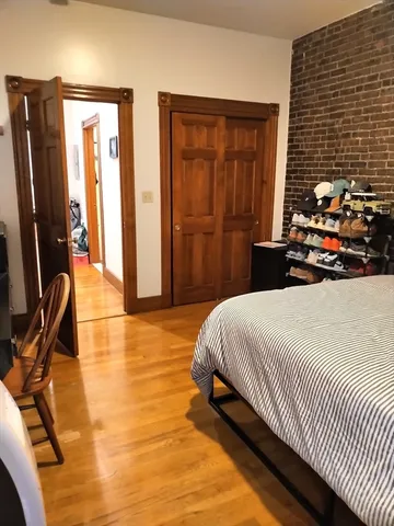 a bedroom with double bed and a window