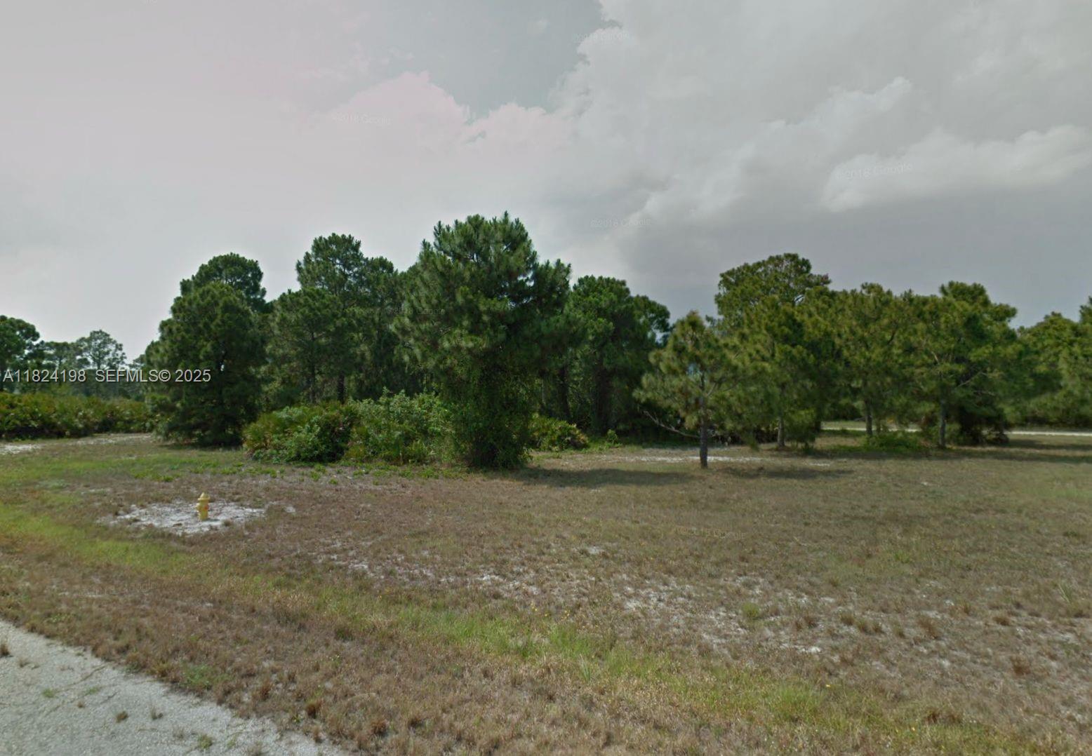 14 Rudder Port Placida, FL 33946 - Photo 1 of 2 a backyard of a house with lots of green space