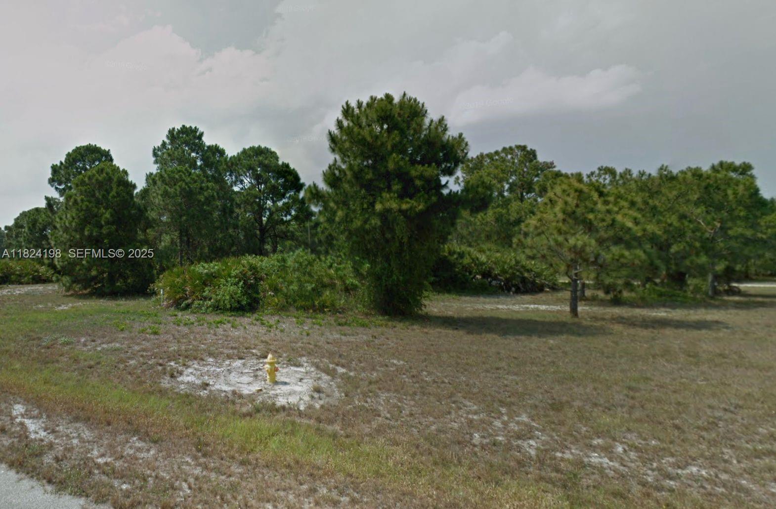 14 Rudder Port Placida, FL 33946 - Photo 2 of 2 a backyard of a house with lots of green space