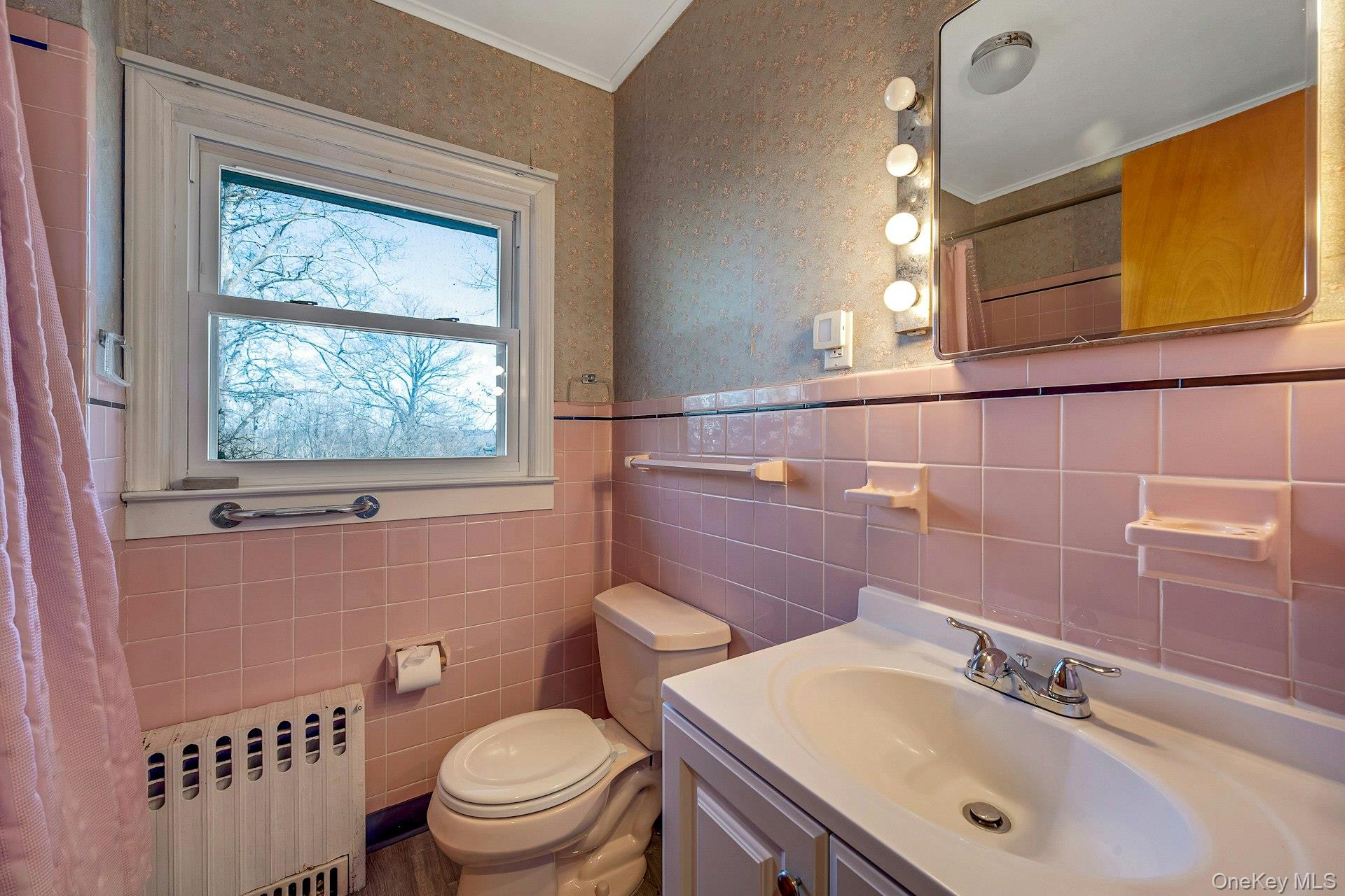 16 Young Road Katonah, NY 10536 - Photo 17 of 26 First floor hall bathroom has shower/tub combo.