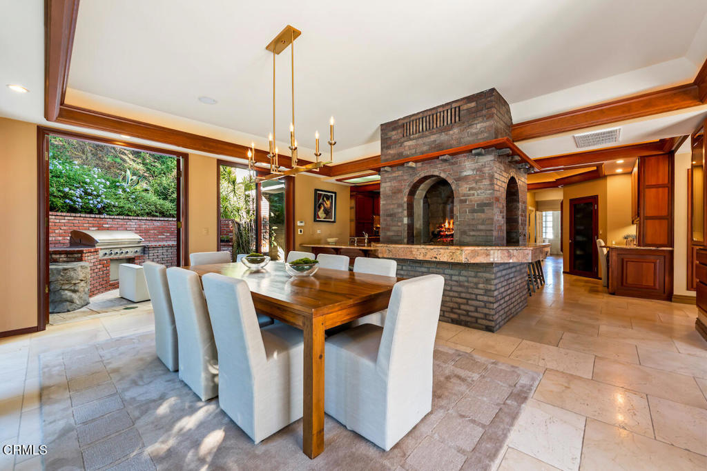 427 Long Canyon Road Bradbury, CA 91008 - Photo 16 of 62 a view of living room kitchen with furniture and outdoor view