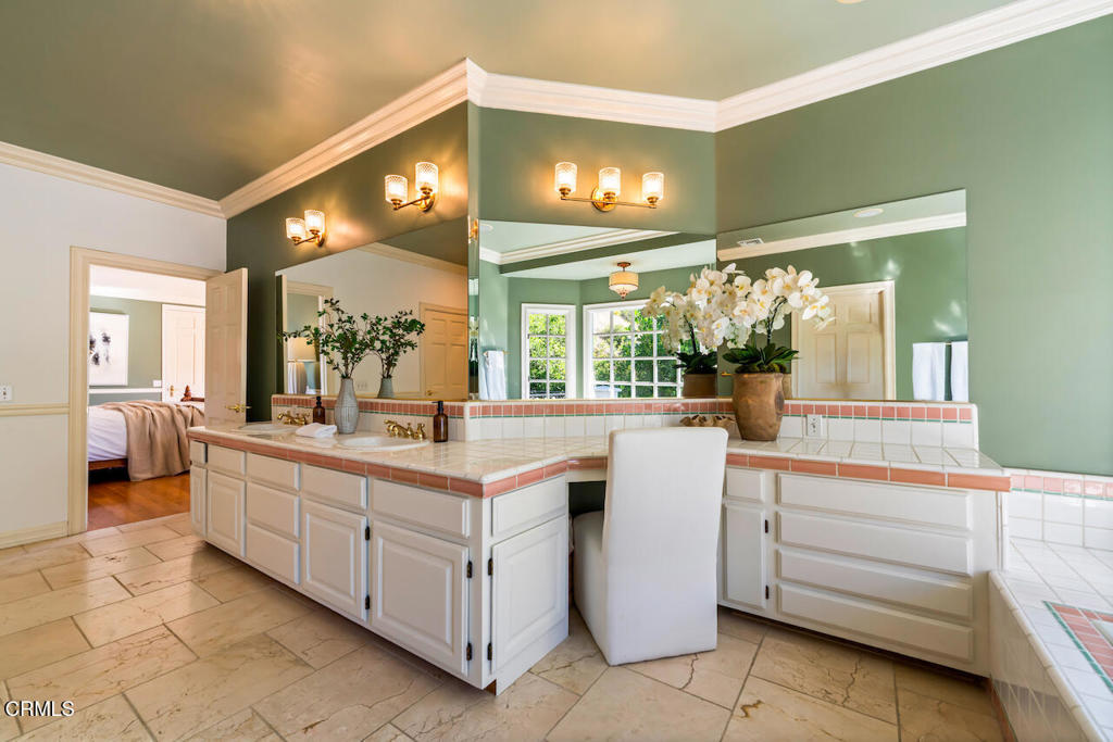 427 Long Canyon Road Bradbury, CA 91008 - Photo 26 of 62 a kitchen with a sink and cabinets