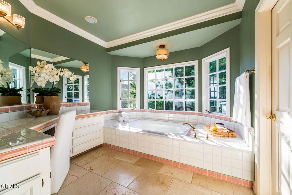 427 Long Canyon Road Bradbury, CA 91008 - Photo 27 of 62 a large white tub sitting in a bathroom next to a window