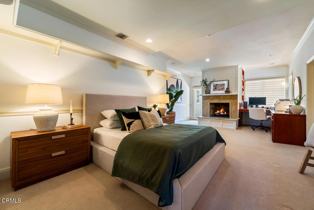 427 Long Canyon Road Bradbury, CA 91008 - Photo 29 of 62 a spacious bedroom with a bed and a fireplace