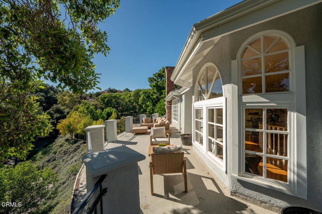 427 Long Canyon Road Bradbury, CA 91008 - Photo 36 of 62 a view of a patio with table and chairs and potted plants