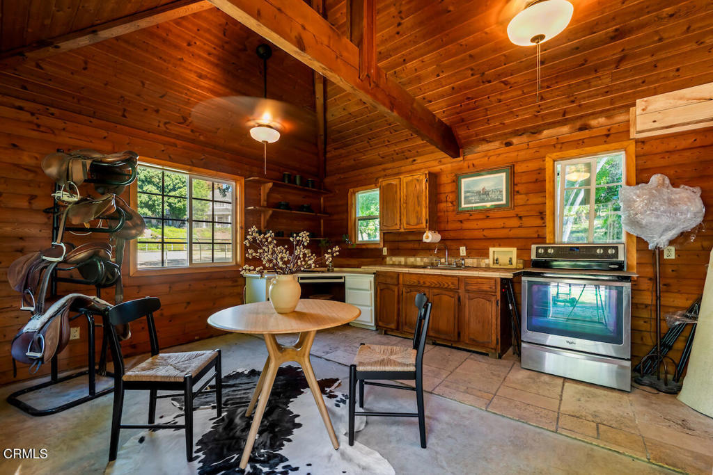 427 Long Canyon Road Bradbury, CA 91008 - Photo 43 of 62 a view of a dining room with furniture and window