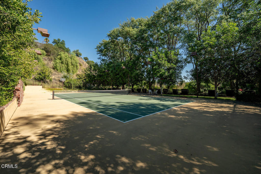 427 Long Canyon Road Bradbury, CA 91008 - Photo 47 of 62 a view of a field with trees in the background