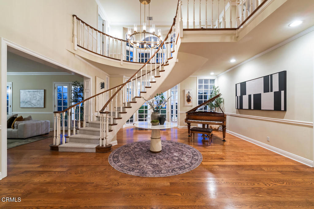 427 Long Canyon Road Bradbury, CA 91008 - Photo 49 of 62 a living room with furniture and a wooden floor