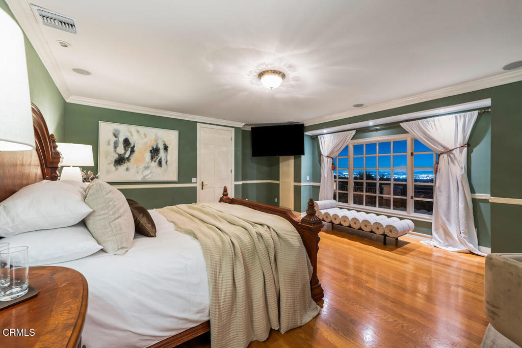 427 Long Canyon Road Bradbury, CA 91008 - Photo 50 of 62 a bedroom with a large bed and a view of balcony