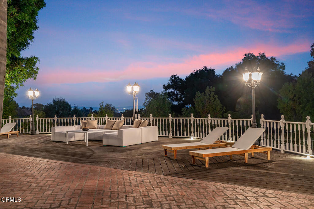 427 Long Canyon Road Bradbury, CA 91008 - Photo 56 of 62 a roof deck with a table and chairs