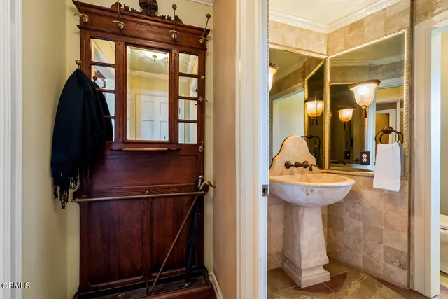a living room with fireplace furniture and a chandelier