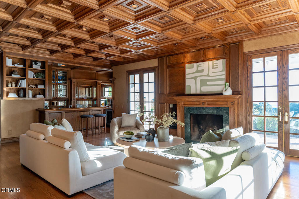 427 Long Canyon Road Bradbury, CA 91008 - Photo 10 of 62 a living room with furniture and a fireplace