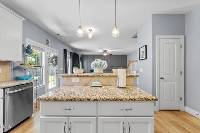 a kitchen with a sink stove and microwave
