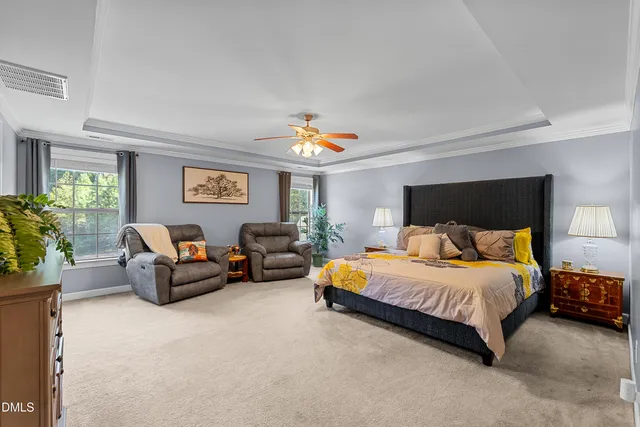 a bed room with bed and a flat screen tv