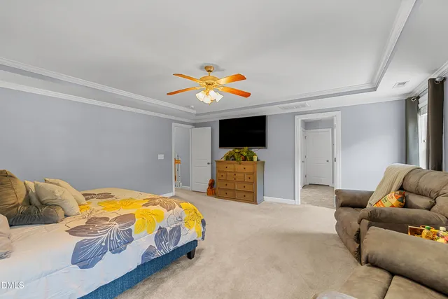 a living room with furniture and flat screen tv