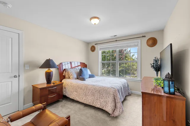 a bedroom with a bed and couch