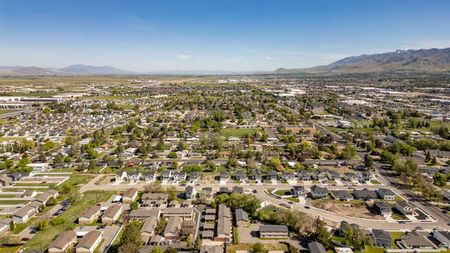283 West 600 North, Unit 2 Logan, UT 84321 - Photo 23 of 36 Expansive aerial perspective showcasing a residential area with a diverse range of homes