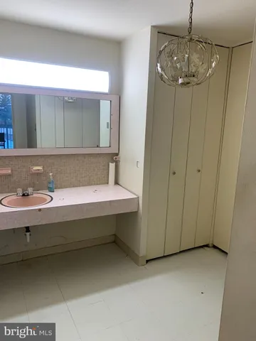 a bathroom with a tub and a sink