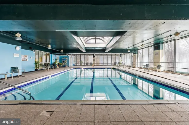 a view of swimming pool with a chair